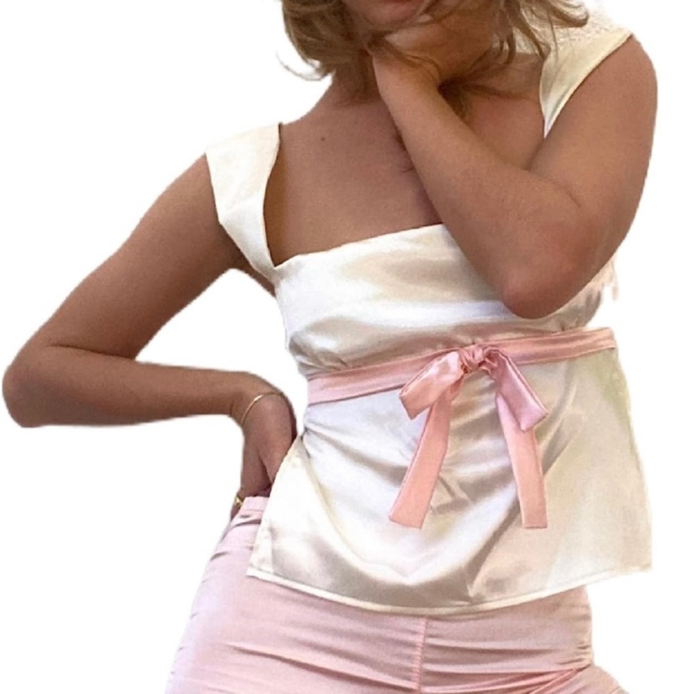 Backless satin top with a pink bow in the front.New.TAGS.large.Urban Outfitters